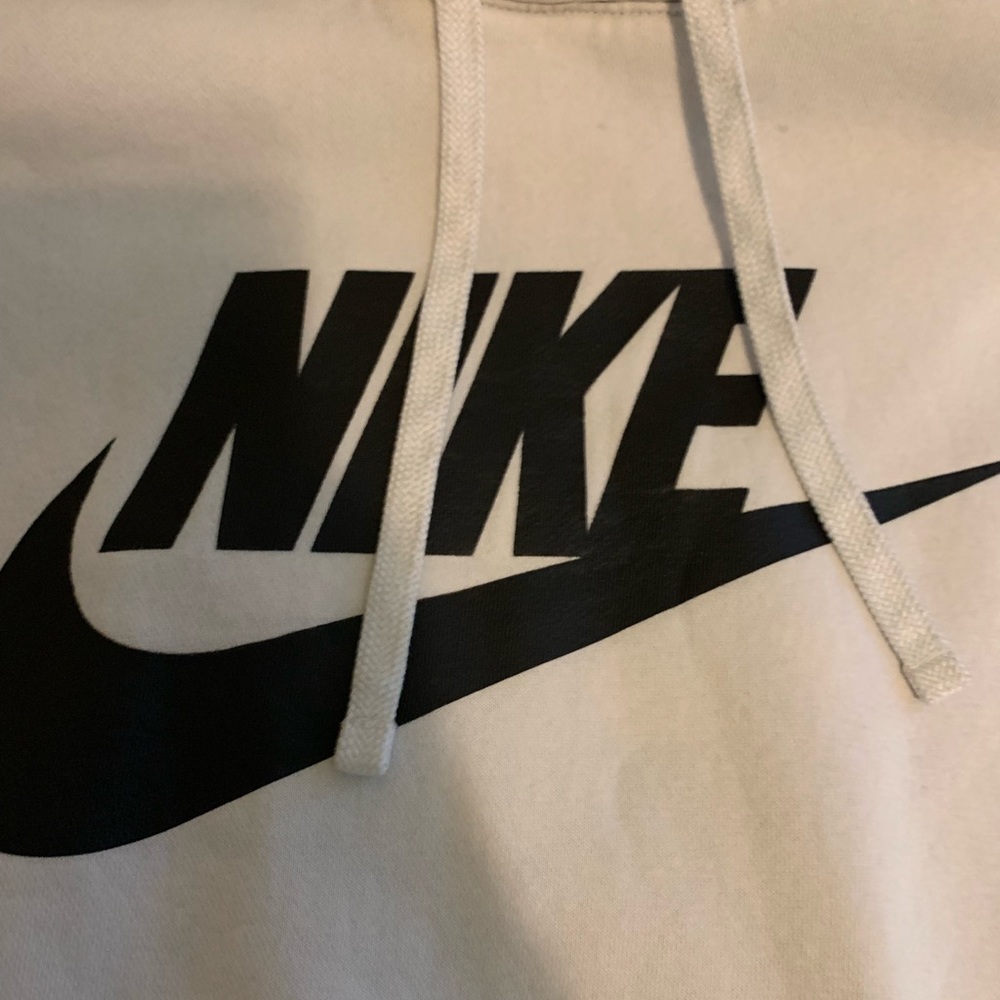 White Nike hoodie with classic black letters.